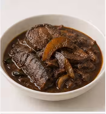 Ambul thiyal, a dark sour fish curry