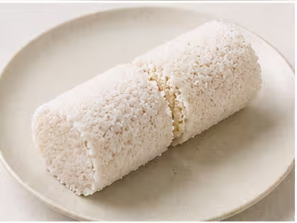Steamed pittu, cylinders of rice flour layered with coconut