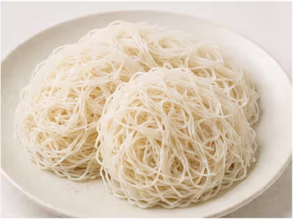 Steamed string hoppers, thin noodle-like rice discs